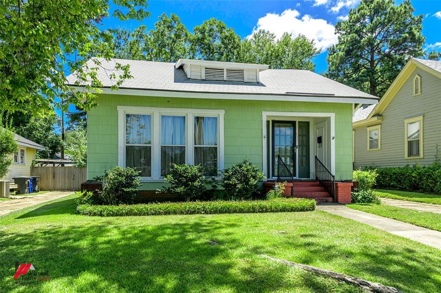 Located in the heart of Shreveport’s historic Highland neighborhood, this Craftsman-style bungalow blends classic charm with thoughtful updates & flexible living spaces. The home features tall ceilings, large windows that bring in plenty of natural light, & a spacious living & dining area anchored by a decorative fireplace. Luxury vinyl plank flooring was installed in 2022, creating a smooth flow through the main living areas, while the bedrooms feature updated carpet for added comfort.

The kitchen offers abundant cabinetry, quartz counters, gas cooking, a coffee bar setup, & space for laundry & pantry storage. An additional nook off the kitchen adds versatility—perfect for a small breakfast area, hobby space, or reading corner. Three comfortable bedrooms sit off a central hallway along with a full bath offering granite-style counters, built-ins, & linen storage. A bonus room with ceiling fan & closet provides added flexibility for an office, nursery, workout area, or playroom.

Recent improvements include newer energy-efficient windows with a transferable warranty, a 2020 roof, & HVAC under an active service contract. Outside, the partially fenced backyard offers space for gardening or relaxation, along with covered parking via a 2-car carport & additional paved parking.

Enjoy the walkable, vibrant Highland lifestyle with close proximity to nearby parks, local cafés, LSU Health, Centenary College, downtown Shreveport, shopping corridors, & quick access to I-49 & I-20. Situated near top-rated area schools & surrounded by sidewalks, tree-lined streets, & neighborhood character, this home offers both convenience & timeless appeal.
(Some interior photos include virtual staging.)