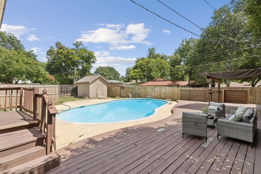 Set on a quiet street in one of Dallas’s most established neighborhoods, this 4-bedroom, 3-bath home offers a beautifully refreshed living space designed to feel open and bright, but is priced to allow you to make it your own and design the rest accordingly! Step through the solid wood front door and into an airy interior where the floor plan has been opened up, perfect for gathering. Crisp white paint throughout enhances the sense of space and reflects the natural light pouring in from the windows. The living room draws you in with its gleaming hardwood floors and a painted white brick fireplace that anchors the space with texture and warmth. Just beyond, the kitchen features sleek granite countertops and mosaic tile backsplash that gives it a clean, fresh feel. A breakfast bar connects seamlessly to the main living space, ideal for conversation and relaxing. A set of French doors leads to the expansive bonus room. It offers flexibility as a media room, playroom, or office, and includes a utility room and a fully renovated full bath with a gorgeous frameless shower inside. The flexible bedroom setup features 2 beds down and 2 beds up, and multiple options as your primary suite. Another fully updated bathroom downstairs is the true standout, featuring a new double vanity with quartz counters and sleek chrome finishes. Upstairs, the largest bedroom in the house features a cozy seating area beside a painted brick fireplace. Cool off during the Texas summer in the private pool! The pool equipment has been serviced to ensure it's in great working order. The storage shed offers extra storage space, and a fence has been added across the driveway for privacy and function. With a new HVAC system installed in 2023 and added attic insulation, this home offers peace of mind and helps keep utility bills down year-round. Located minutes from White Rock Lake, great local dining, and commuter routes, this is your chance to get into the Lake Highlands area way below average prices!