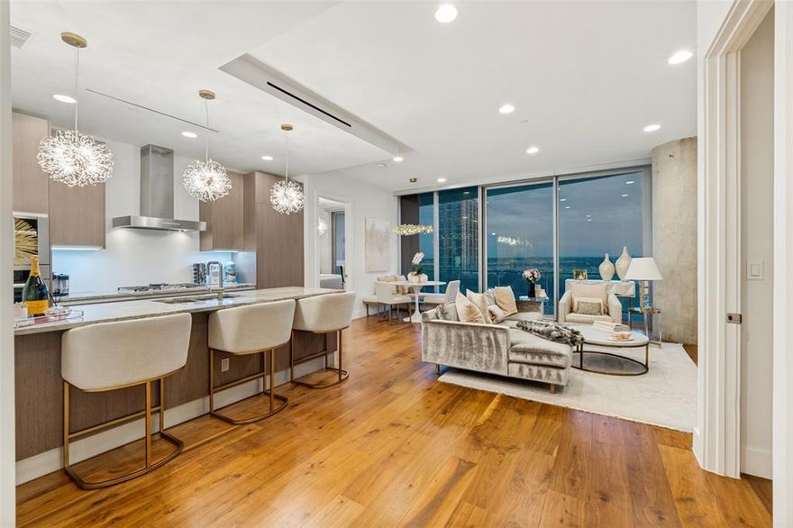Meticulously maintained unit with incredible city views in the highly sought after Bleu Ciel Hi-Rise. This 2-bed 2.5-bath condo features an open floor plan with floor to ceiling windows, hardwoods throughout, decorative lighting, custom California closets and electronic shades.. The kitchen features Miele appliances, Porcelanosa cabinets and marble countertops, providing a state of the art kitchen for any level of chef. The bedrooms feature black out shades, walk in closets and en-suite baths. This unit features a 396 square foot balcony providing a great space for morning coffee or a glass of wine in the evening. The building features unparalleled amenities such as two junior olympic size pools, a resident only spa, wine room, two executive board rooms, social room with library, private garages, fitness room with state of the art equipment, dog run, 24-7 concierge and valet, and direct access to the Katy Trail. This unit features a private two car garage.