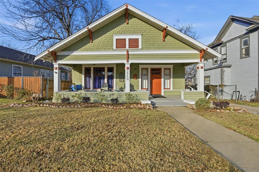 Located in Historic Fairmount, this fully updated 1920s Craftsman bungalow pairs original architectural detail with smart, timeless updates and a standout outdoor space. Living in Fairmount is a lifestyle, where friendly neighbors, tree-lined sidewalks, and inviting front porches create a true sense of community. A wide covered front porch frames the façade and offers a natural place to sit, unwind, or chat with neighbors. Inside, warm wood floors run through the living and dining areas, anchored by a decorative fireplace and traditional double-hung windows that bring in natural light. The kitchen features crisp white cabinets, leathered granite countertops, stainless appliances, and loads of counter space. The primary bedroom opens to the deck and backyard through a private exterior entrance. Its en-suite bath features dual sinks, classic penny tile, and a walk-in shower. A second bedroom and full bath echo the same clean, updated design and offer flexible space for family, guests, or a home office. Out back, a raised deck extends your living space outdoors—ideal for grilling, dining, or slow weekends in the shade. The fenced yard is anchored by a custom putting green that adds personality and function, whether you’re practicing your short game or hosting friends. Just minutes from downtown, Magnolia Avenue, TCU, the medical district, local parks, and cultural destinations, this home offers a walkable, neighborhood-driven lifestyle with quick access to everything Fort Worth has to offer.
