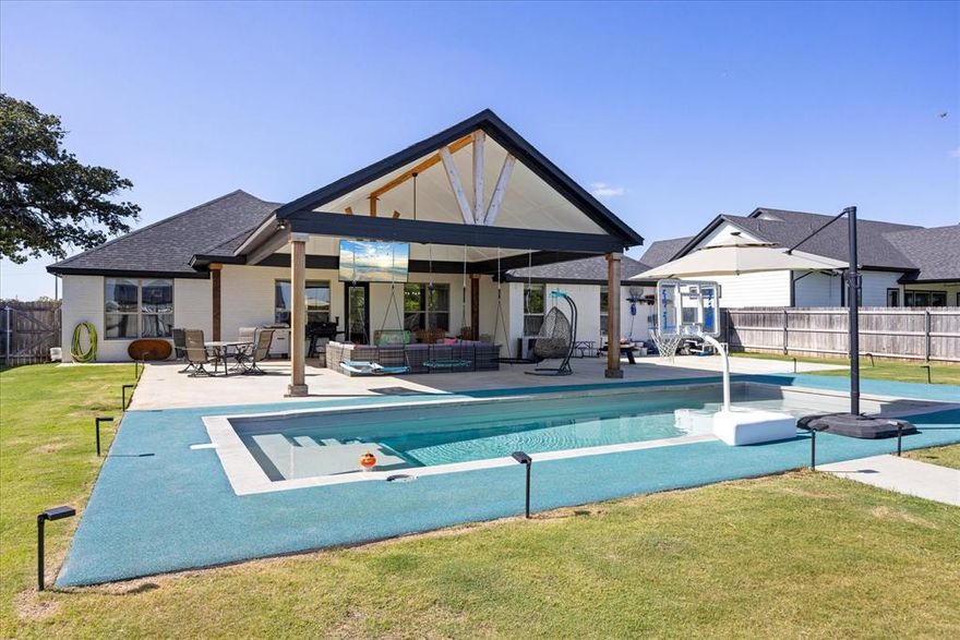 If you’ve been waiting for a property that checks every box including space, style, and next-level entertaining, this is it! Built in 2020 and sitting on nearly half an acre, this 4 bedroom, 2 bath home offers the perfect blend of modern design and outdoor living. Step outside to your private backyard retreat featuring over 600 square feet of extended covered patio space, ideal for hosting game days, family gatherings, or quiet evenings overlooking the pool. The impressive 14’ x 36’ in-ground pool makes Texas summers something to look forward to. Need room for projects, storage, or a home-based business? The 30’ x 40’ fully equipped shop is perfect for a gym, workshop, boat storage, or all of the above. Inside, the open-concept layout creates an easy flow from the spacious living room into a beautifully designed kitchen with granite countertops, stainless steel appliances, and generous prep space. The primary suite offers a private escape with a large bedroom and en-suite bath featuring a granite double vanity and a separate tiled shower. The guest bath mirrors the home’s quality with granite countertops and a tiled shower with built-in inserts. You’ll also appreciate the no-carpet design throughout the main living areas and bedrooms, offering both durability and easy maintenance. Located in the desirable Tolar ISD, this home delivers the space you want with the upgrades you don’t often find. Don’t miss your chance to own a home that’s a functional as it is fabulous!