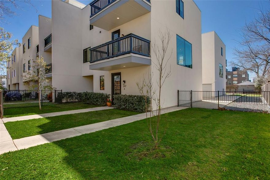 Nestled in the vibrant heart of East Dallas, this sleek 3-bedroom, 3-bath home boasts an open floor plan with high ceilings, multiple outdoor spaces, and a rare 3-car garage.

A highly coveted corner unit, the home features windows on all three sides, flooding the space with natural light. The kitchen is a chef’s dream, featuring quartz countertops, stainless steel appliances, and a spacious island perfect for entertaining or casual meals. The adjacent bar provides an additional space for entertaining & kitchen storage. The two living spaces offer incredible versatility, plus the convenience of a full bathroom on this level adds to its functional charm.

The primary suite is a true retreat, offering a spa-like bath with a walk-in shower and a generous walk-in closet. The two secondary bedrooms are equally inviting, ideal for guests, an office, or a flex space to suit your lifestyle. The home has been thoughtfully upgraded with motorized shades, offering both convenience and enhanced privacy

Step out into your private corner yard or onto one of two serene balconies—perfect spots to savor your morning coffee or let your furry friend explore freely.

Located just minutes from Lower Greenville, Knox Henderson, and Downtown Dallas, you’ll have access to the city’s best dining, shopping, and entertainment right at your fingertips. This location has it all.