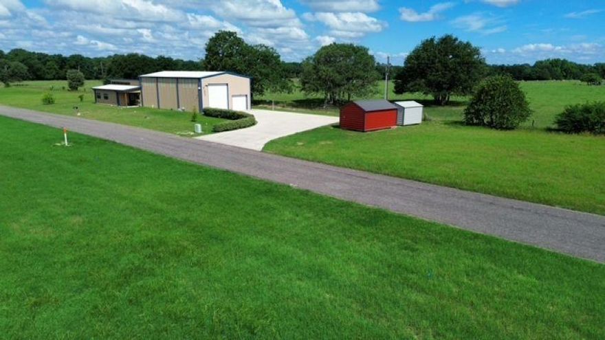 Are you tired of paying for RV storage or dealing with HOA’s? Looking for country living yet close enough to town for the conveniences? Want to get away to fish or boating fun? Lake Holbrook is 3.5 miles and Lake Fork is 13.5 miles from property. Then this home is your opportunity to live with freedom. This home sits on approximately 2 acres of unrestricted land. The garage has a massive 14’ door for your RV, boat, or fifth wheel on one side; and deep enough to park two autos on the other side. Whether you’re an RV’er, snowbird or weekend warrior, this property gives you a total of 3434 sq ft under roof:  1,574 sq ft living space and 1860 sq ft insulated garage with full (50 amp) hookup and loft for storage.  The home features a fabulous kitchen with granite counters and ample cabinet space with open floor plan to large living room featuring aerial view windows with remote control blinds.  Primary bedroom features an extra large walk in closet and huge bath with separate full size counters, large walk in shower with 3 shower heads and full size tub. Fiber optic WiFi available. Schedule your showing today!