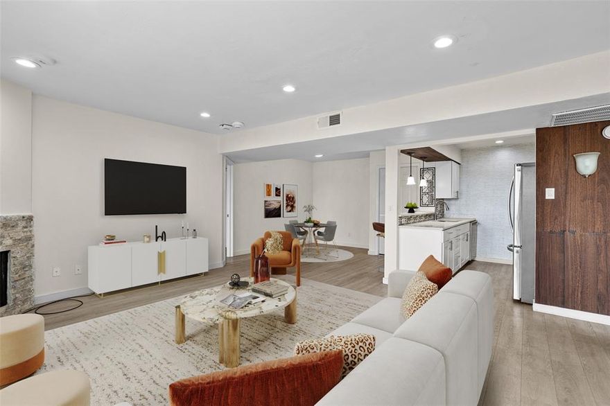 Welcome to this bright and updated, low maintenance elevatored top-floor condo offering spacious open living and fantastic community amenities, all within highly regarded Richardson ISD. The living area features modern flooring, recessed lighting, a stone-accent fireplace, and large sliding doors that open to a private covered balcony with elevated views. The kitchen is beautifully refreshed with sleek countertops, stainless steel appliances, mosaic backsplash, and bar seating that connects seamlessly to the living space—perfect for everyday living or entertaining. The bedroom is generously sized with ample closet space, while the bathroom includes an updated vanity and tub-shower combination. A brand-new washer, dryer, and refrigerator are included for added convenience, along with a newer HVAC system. Located in a well-maintained community with three swimming pools (one just steps away), a tennis court, and a dog park (also just a few steps away), residents also enjoy the convenience of an Amazon locker located inside the building. HOA covers major exterior structures including roofs and siding, as well as common areas, plus water is included—no separate water bill. Easy access to 635, 75, and major Dallas corridors makes commuting simple while keeping shopping, dining, and entertainment close by. Comfortable, convenient living in a prime Dallas location.