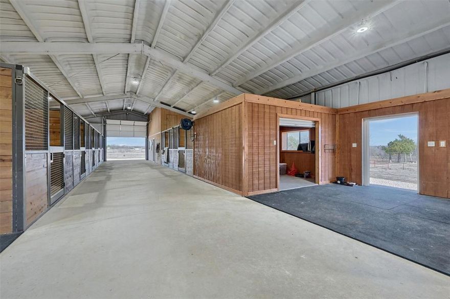 Welcome to 2824 CR 107 in Whitesboro, TX—a turnkey horse ranch where wide-open spaces, luxury living, and top-tier equestrian amenities come together on 25+ acres of prime Texas land. Whether you're a serious competitor, a horse enthusiast, or just someone who loves the peace of country living, this property has it all.

At the heart of the property sits a stunning 3,500 sq. ft. custom-engineered barndominium. Step inside, and you're greeted by a bright, open-concept living space, flooded with natural light and breathtaking views of the surrounding pastures. The kitchen is built for entertaining, plenty of prep space, and room to gather. Enjoy the wood-burning fireplace on cooler days. With three spacious bedrooms and two well-appointed baths, there’s room for the whole family. The primary suite features an expansive walk-in closet and a en-suite bath. Upstairs, a flex space in the loft offers endless possibilities.The front and back porches are perfect spots to sip coffee at sunrise or unwind as the Texas sky lights up in the evening.

The 10-stall show barn is an absolute dream. It’s not just functional—it’s top-of-the-line.
Spray foam insulation, custom stalls, large wash bay, tack-up area, and an enclosed tack room make chores a breeze.
LED lighting and fans ensure a comfortable space. Also included is spacious office with a bathroom. 

With fertilized coastal pastures, you'll have high hay yields and premium grazing. Each paddock is outfitted with pipe and no-climb fencing, along with a loafing shed and water. Sandy loam soil covers the property, providing perfect footing and drainage.
Already graded for a 125x275 riding arena, this property is primed for future expansion. Covered trailer parking and an RV hookup, make travel easy.
Just an hour from the DFW Metroplex and less than 30 minutes from Sherman, Gainesville, and Lake Texoma.
Come visit this great N TX horse property and see for yourself why it's the perfect place to call home.