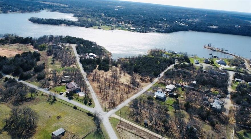 IS LAKE LIFE CALLING YOUR NAME? Here’s your chance to answer it! This haven can all be yours!

Consisting of 2.12 beautiful, build ready acres, this property is tucked inside a small, peaceful, family-friendly neighborhood you’ll instantly want to call home. Build your dream lake house with electricity, a water well, and septic already on-site! They may need a little TLC, but the major players are already there, saving you time and money.

With frontage on both Catfish Trail and Bass Lane, the layout offers excellent flexibility. There’s plenty of room for a primary residence, guest house, workshop, or multi-home family setup. 

Bring your kayaks, jet skis, boats, fishing gear, and the whole family to enjoy this newly cleared property with Lake Amon G. Carter in your backyard. The only thing separating you from the lake? A small strip of undeveloped, unoccupied community property. 

This lake is known for BIG Bass, Catfish and Crappie, fishing tournaments, boating, jet skiing, 4th of July fireworks, and nonstop family fun. If you live here full time you'll never tire of the breathtaking sunsets and relaxed vibe!

Selma Park and the public boat ramp are less than a mile away, giving you quick access to all the summer adventures. And you’re only 7 miles south of charming Bowie, TX, where you’ll find boutique shopping, necessities, and small-town events such as Pro Rodeo's and Second Monday trade Days! 

Commuting? Easy! Hwy 287 is just 7 miles away, Decatur: 34 miles, Denton: 60 miles, Wichita Falls: 50 miles.

Imagine coming home each day, dipping your toes in the lake, wetting a hook and catching a sunset while breathing in the fresh lake air—all from your own slice of paradise. 

Don’t wait for summer, start your lake life now. THIS is the spot you’ve got to see!