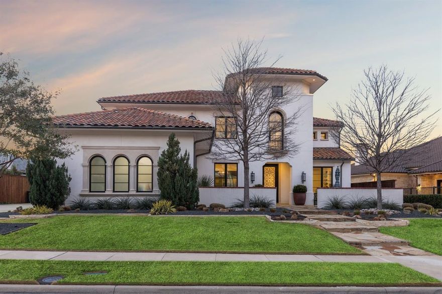 This Spanish-style home designed by award-winning architect Lloyd Lumpkins boasts a variety of amenities. Operable glass wall system opens the family room to the outdoor living area, pool and spa, providing a seamless connection with nature. Transitional modern finishes and timber trusses. The gourmet kitchen is equipped with quartzite countertops, an island, self-closing quiet drawers, double dishwashers, sub-zero freezer, built in refrigerator, warming drawer, and commercial-grade appliances that will impress even the most discerning chefs. Downstairs has additional breakfast room, a media room, dining, library with a computer niche, a mudroom off the utility room, a 3-car garage, additional bedroom and master suite. Indulge in luxury in the spacious master suite, freestanding tub and separate shower, his and her closets. The second story has 3rd 4th bedrooms with a Jack-Jill bath. The 5th bedroom with loft and balcony and ensuite bath. The attic space is designed as a workout room.