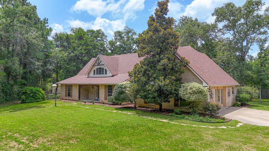 Price reduction!!  Welcome home to this gem tucked away in a cozy cud-da-sac!  Four bedroom split floor plan home nestled deep into the back of a culdesac road.  Three bedrooms and two bathrooms downstairs and one bedroom and full bathroom up.  Large game room with large closet and built in entertainment center is ready for your pool table or could use as a large family room.  Roomy kitchen with new countertops.  Large living room for entertaining family and guests.  Left side of home has newer AC as of 2023.  New hot water heater in 2024.  New roof in 2021.  Large 30 x 35 metal garage (or shop) with 3 roll up doors and one walk-in door.  Additional 25 x 30 concrete slab with built-in basketball goal and solar lighting.  Could build another building on this slab.  Sprinkler system!  So much space - this is a must see!!  Country living, yet close to I-45 and just minutes from some great eating establishments.