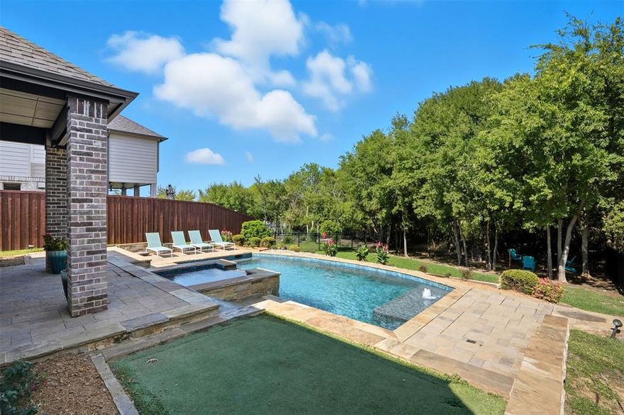 Rare Opportunity in Little Elm – Pool, Spa & Lake Access

Don’t miss this exceptional chance to own a beautifully maintained 4-bedroom, 3-bath home just steps from Lake Lewisville. With no rear neighbors and peaceful green space behind, this property offers a private backyard retreat and the best of lakeside living.

Built in 2016, the desirable 1.5-story floorplan features soaring 11-foot ceilings and an open-concept layout designed for both everyday comfort and effortless entertaining. The living, dining, and kitchen areas are lined with abundant windows that flood the space with natural light and showcase stunning views of the backyard oasis. The gourmet kitchen shines with a 36-inch gas cooktop, farmhouse sink, abundant cabinetry, and sleek finishes, flowing seamlessly into the main living areas anchored by a cozy gas fireplace. Durable plank tile flooring throughout the main level adds both style and function.

Upstairs, a private fourth bedroom with a full bath provides flexible space ideal for a guest suite, home office, or media room.

Step outside to your resort-style backyard oasis, complete with a sparkling pool, relaxing spa, firepit, and partial lake views. With green space behind and walkable access to Lake Lewisville, you’ll enjoy both tranquility and outdoor adventure right at your doorstep.

Located in one of Little Elm’s most sought-after areas, this home offers the perfect blend of luxury, privacy, and convenience. Seller-paid rate buydown available to help reduce the buyer’s interest rate and monthly payment — see disclosures for details.