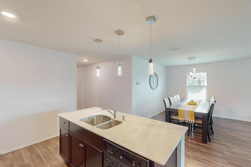 Discover the perfect blend of style, space, and location in this beautifully maintained 4-bedroom, 2-bath home nestled on a premium corner lot in a sought-after neighborhood.
Step inside to an inviting open-concept floor plan that seamlessly connects the spacious living area, dining space, and modern kitchen, ideal for entertaining guests or enjoying cozy nights in. The kitchen features sleek countertops, stainless steel appliances, and a large island. Enjoy outdoor living with a large backyard and side yard, perfect for BBQs, play, or relaxing under the Texas sky. Being on a corner lot means more space, more privacy, and extra curb appeal.
Located minutes from shopping, dining, and major highways, this home combines convenience with comfort.
 
Buyers and their agents should verify schools, square footage. Supra on the front door.