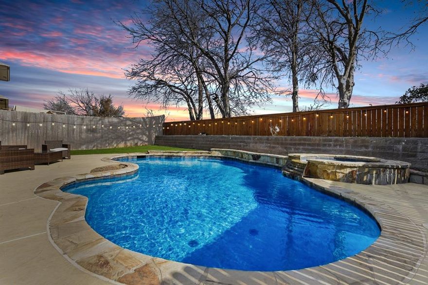 4-bedroom, 2.5-bath home with 3,295 sqft located in Fort Worth, TX, within the Villages of Woodland Springs subdivision and Keller ISD. The home features new carpet, multiple living spaces, and a backyard that backs to larger lots, providing added separation from neighboring properties.

The two-story layout includes formal living and dining rooms, a family room with gas log fireplace, an upstairs game room, and a loft suitable for an office or flex space. The kitchen includes granite countertops, stainless steel appliances, built-in cabinets, breakfast bar, and adjacent breakfast room. The primary bedroom is located on the main level with an ensuite bath featuring dual sinks, separate shower, soaking tub, and walk-in closet. Secondary bedrooms are located upstairs.

The backyard includes an in-ground pool with separate spa and water feature. Community amenities include clubhouse, community pools, playgrounds, greenbelts, lakes, jogging and bike paths, and sports courts. Convenient access to shopping, dining, and major roadways throughout Fort Worth and North Texas.