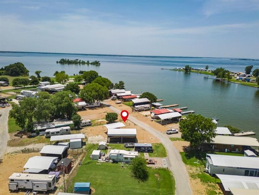 Triple Lot Package at Richland Chambers Lake – Ready for Summer!

Now is the perfect time to secure your lake retreat! This package deal includes three lots (39, 40 & 41) in the sought-after Pelican Isle Resort—a gated, lakeside community on Richland Chambers Lake, the 3rd largest lake in Texas. Already set up and ready for your RV or tiny home, these lots make for the ideal weekend escape or seasonal getaway.

Enjoy peace of mind with gated access, plus community perks like a private boat ramp, clubhouse, pool, onsite laundry, and outdoor fun with horseshoes, washers, and a shaded picnic area. Two steel awnings offer protection and comfort, with gravel surfaces to reduce dust and a shaded RV carport with screens to help keep cool during those hot Texas afternoons.

There’s plenty of extra parking and awning space, so you can host family and friends with ease. Whether you’re looking for a relaxing retreat or a home base for summer fun on the water, this setup is ready to go.

Seller financing available! Don’t wait until summer is in full swing—opportunities like this don’t last long.
Boat not included.