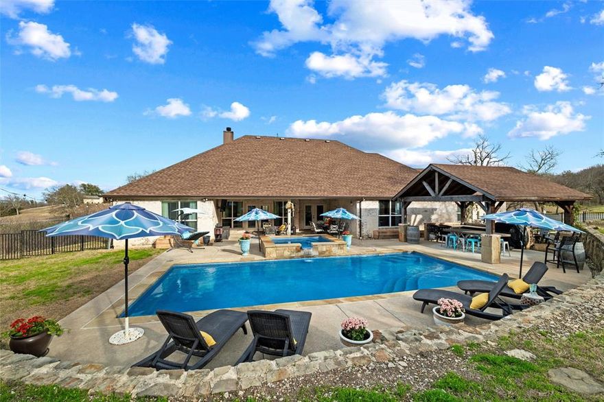 Seller incentive of $8,000 being offered to assist with rate buy down or closing costs! Welcome to 128 Remuda Ct, a stunning one-story home in the sought-after Remuda Estates community of Aledo, offering 4 bedrooms, 2.5 bathrooms, and 2,613 square feet of thoughtfully designed living space with no city taxes and no HOA. Built in 2015 and located within highly acclaimed Aledo ISD, this open-concept home combines comfort, functionality, and style. The spacious kitchen is the heart of the home, featuring a charming farmhouse sink, stainless steel appliances, and seamless flow into the living and dining areas—perfect for everyday living and entertaining. A dedicated office provides the ideal space for working from home or managing daily tasks. The laundry room includes space for an additional refrigerator, adding extra convenience and storage. Step outside to your private backyard retreat complete with a sparkling pool, relaxing hot tub, pergola-covered seating area, an entertainer’s dream and the perfect setting for enjoying Texas evenings. The oversized 2-car garage provides additional storage and flexibility, while the expansive lot offers privacy. Combining comfort, style, and exceptional outdoor living, this property delivers the best of country-style space with the convenience of being close to everything Aledo has to offer.