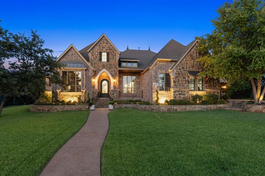 THIS HOGAN'S GLEN BEAUTY IS ONE OF THE MOST GORGEOUS HOMES YOU'LL FIND IN TROPHY CLUB'S EXCLUSIVE GUARD GATED COMMUNITY! Its charm is captured by its beauty and the beauty of the Hogan's Glen community but step inside & you'll fall in love with stunning renovations & well appointed details from architectural paint colors, expansive gourmet kitchen w new custom cabinetry, Taj Mahal Quartzite stone countertops, authentic Zellige Moroccan tile backsplash, GE Monogram Professional appl's & stunning views of the backyard oasis. Here you will enjoy a loggia w Summer kitchen, cozy fireplace, sounds of the pool's grotto waterfall & 2 large side yards w artificial turf intertwined w stone walkways & lush landscape. Flowing seamlessly thru-out, this ideal floor plan offers 5 beds w ensuite baths, main floor primary & guest suites & a main floor media room. Perched on a premium cul de sac lot, backing to a park, it is conveniently located to Dallas & FW, DFW Airport & all of life's conveniences.