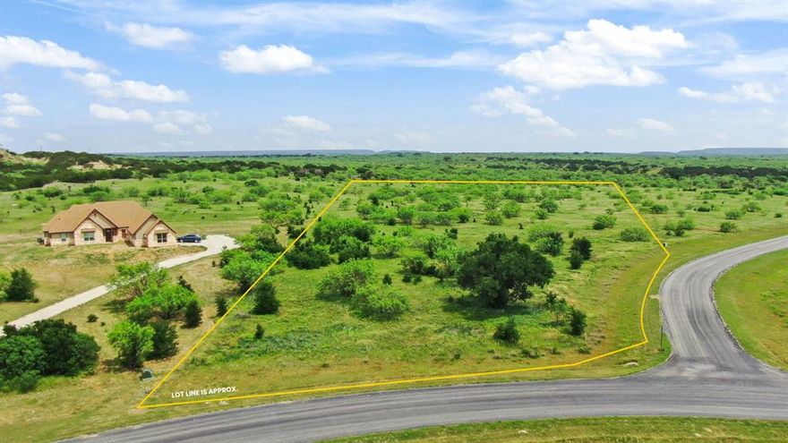 The Hills Above PK is one of the most prestigous communities in Palo Pinto County and surrounding.  This beautiful 5.02 acre lot comes complete with electricity and water, beautiful trees and views of the Palo Pinto Mountains.  No time limit to build and you can bring your own builder when you're ready to make your dreams come true.  Plenty of room to roam and explore the outdoors in this gorgeous corner lot.  Min 2,000 sf home.  Possum Kingdom Lake is one of Texas' most premier lakes of which you have unlimited access.  Amenities include community boat dock, infinity pool, clubhouse, fitness center, fishing, hiking, private gated entry and more!  Hills Above PK community is minutes to dining, shopping, medical facilities in Graham or Mineral Wells.