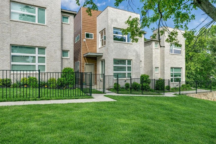 Modern design meets low-maintenance living in this beautifully maintained lock-and-leave home in the desirable Oakbend community. Featuring a striking contemporary façade with a blend of brick and wood, this residence offers a light-filled open floor plan with 3 bedrooms, 2.5 baths, plus a versatile loft or office space. The main living area showcases luxury vinyl flooring with the look of wood, soaring ceilings, and abundant natural light, flowing seamlessly into a well-appointed kitchen with granite countertops, stainless steel appliances, ample cabinetry, and a center island perfect for everyday living and entertaining. Large windows frame peaceful views of the surrounding green space, creating a serene backdrop throughout the home. Upstairs, the spacious primary suite offers tranquil treetop views, giving a treehouse-like feel, along with a well-appointed bath featuring dual vanities, soaking tub, and separate shower. Secondary bedrooms and flexible loft space provide room for guests, work, or play.
Enjoy a private, fenced yard ideal for pets and easy outdoor living. Additional highlights include custom window treatments, updated lighting with contemporary ceiling fans, energy-efficient systems including a newer water heater and upgraded HVAC, and a two-car garage. Ideally located with quick access to Highway 121, I-35, and DFW Airport, and just minutes from shopping and dining, including Costco, Target, and more. HOA includes exterior maintenance, landscaping, water, sewer, and trash for true low-maintenance living.