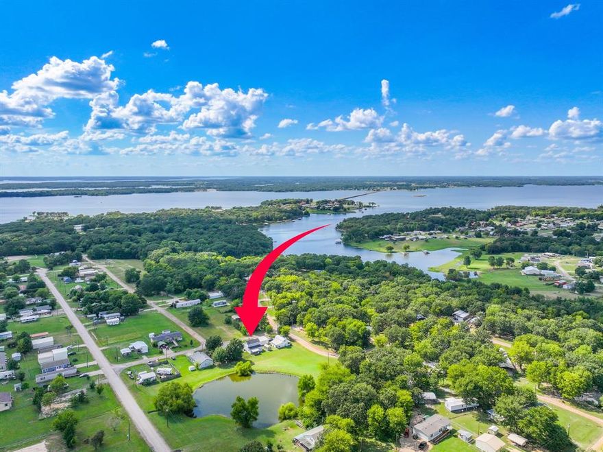 Experience the best of lake living in this beautifully updated three-bedroom, two-bath home located in the gated community of Holiday Villages on Lake Fork.
The inviting open floor plan features a spacious living area, an eat-in kitchen with stainless steel appliances, and the convenience of the primary suite located downstairs. Renovated with comfort in mind, updates include a newer roof, HVAC, and modern finishes throughout. Upstairs, two additional bedrooms provide plenty of space for guests or family.
Step outside to enjoy a private backyard retreat overlooking the community pond. With access to a covered dock, private boat ramp, saltwater pool, clubhouse, and playgrounds—you’ll have everything you need for recreation right at your doorstep.
Currently a profitable short-term rental, this home is move-in ready and may be purchased fully furnished if desired, making it a fantastic investment opportunity or a perfect place to call home full-time. Bring your boat, golf cart, and fishing poles—life at the lake is waiting!