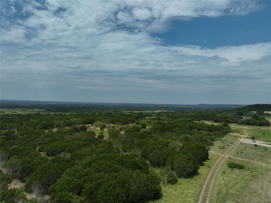 Discover 4.551 acres of private, unrestricted land in the highly desirable Cleburne area—priced at just $129,600 and offering owner financing to make ownership even more accessible. This beautiful property features a mix of native cedar trees, open spaces, and gentle elevation changes that provide scenic views of the surrounding hills. Whether you’re looking to build a home, place a mobile or manufactured home, start a small homestead, or use the land for recreation, you have complete freedom with no restrictions. Enjoy the peaceful setting, rolling terrain, and natural privacy while still being just a short drive from Cleburne’s amenities. This is an ideal opportunity for anyone seeking affordable land with flexibility, views, and room to grow.