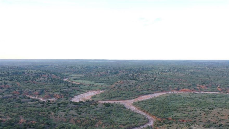Beautiful piece of Texas.  Very secluded ranch with lots of fresh air, and the stars are endless.  Lots of elevation changes with views to die for.  Great hunting with trophy white tail, hogs, quail, and all the varmints you can find.  Fenced, with pens for cattle, 4 fresh water wells with concrete troughs. 3 stock tanks.  Dove creek runs through the ranch with natural springs that create a natural habitat for all animals.  Property is priced with 75% of the mineral interest and 100% of the leasing rights.  Call to look today!!
