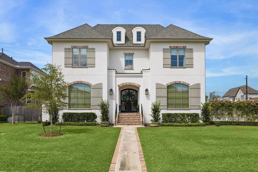 Nestled on an oversized corner lot in the heart of the coveted Braes Heights area, this modern French cottage was masterfully custom built by Frankel Homes in 2019. With a timeless stucco and brick façade boasting a grand rose and ivy wall, the warmth and charm of this home are undeniable as you arrive. Inside, the intentionality of the owner is evident- the custom millwork, wood beams in the family and primary suite, designer and antique mirrors and lighting throughout, three sets of hand-selected antique doors, gourmet kitchen boasting a Wolf sub-zero appliance package, wine refrigerator, and quartzite countertops all showcase craftsmanship at the finest caliber.  The main level offers open concept living between the family room, dining and kitchen, with French doors leading to the veranda, perfect for indoor-outdoor hosting. The unparalleled primary suite featuring stackable washer and dryer connections in the closet, a spacious study, powder room, and mud room complete the first floor. The second level includes three bedrooms with private en-suite bathrooms, laundry room, game room, exercise room and media room. The home features a boastful outdoor space thoughtfully designed to face the side of the home allowing for rare privacy within the city. The show stopping exterior features a professionally designed, French garden inspired yard including a heated pool and spa, brick veranda with outdoor kitchen, fireplace, and oversized ceiling fan to keep you cool even in the summer months. Additionally, the home features a gated entrance and whole home generator, giving you peace of mind 365 days per year. Ideally located near Rice Village, Rice University, The Galleria, Med Center and zoned to Bellaire High School, Pershing Middle School and Mark Twain Elementary, the location blends convenience with premier opportunity.  Designed with hospitality and comfort at the forefront, this home is sure to please those seeking the versatility to host an array of gatherings.