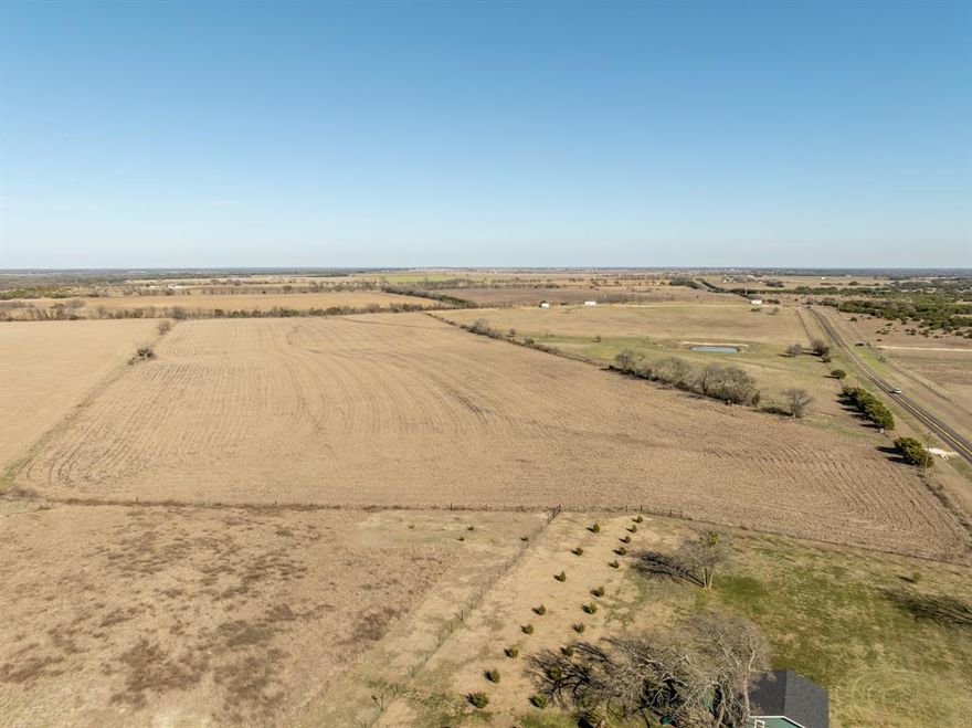 26.5 acres located between Mosheim and Jonesboro.  Land is mainly open with some scattered trees along the fenceline.  Land could be put into hay production or grazing. Fenced on 3 sides with a water meter reserved.  Power is located on FM 217. Property is Ag Exempt.  There are some restrictions in place and a survey on file.  Situated in Clifton ISD and has a Valley Mills address.  Located in Coryell County. Entryway has been put in already with a culvert and gate for access. Old antique tractor will not convey.