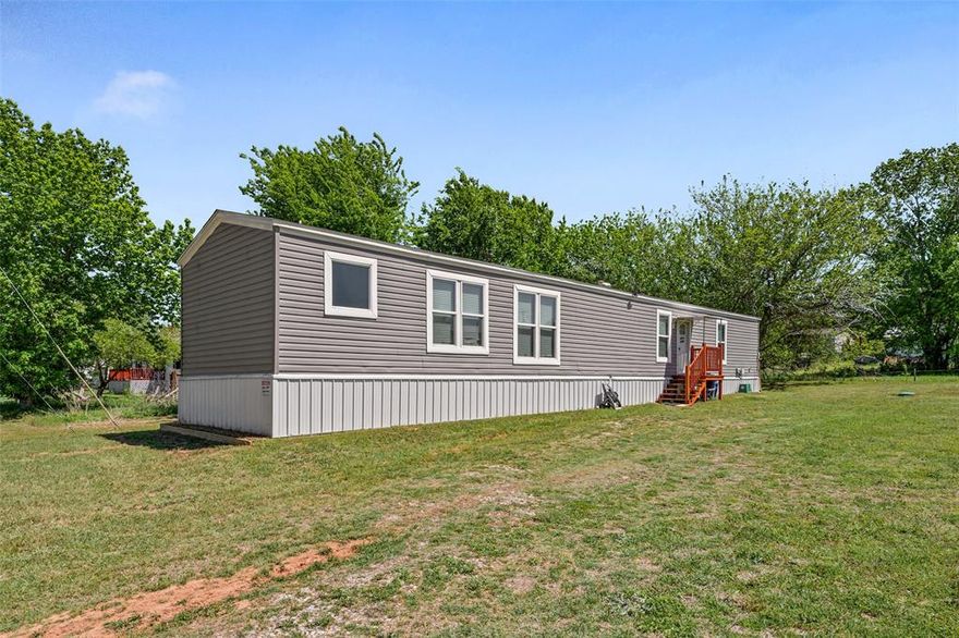 This home qualifies for a limited-time lender-paid 2-1 buydown— reduced monthly payments for the first 2 years at no cost to the buyer or seller. Welcome to 707 Sun Court— a charming home nestled in a desirable waterfront community on Lake Granbury, situated on two spacious lots with a convenient storage building for all your extras.

Inside, you’ll find a warm and inviting layout featuring stainless steel appliances, a kitchen island with breakfast bar, and a classic farmhouse sink—perfect for both everyday living and entertaining. The primary suite offers a relaxing retreat with an ensuite bath complete with dual sinks, a garden tub, separate shower, and a walk-in closet.

This friendly neighborhood is rich in amenities, including a private boat ramp and fishing pier on Lake Granbury, a community swimming pool, playground, and even a volunteer fire department for added peace of mind.

Located just minutes from the vibrant Granbury Square, you’ll enjoy easy access to dining, bars, live music, wineries, boutique shopping, and the scenic hike and bike trail. Whether you’re looking for a full-time residence or a weekend getaway, this property offers comfort, convenience, and a true lakeside lifestyle.