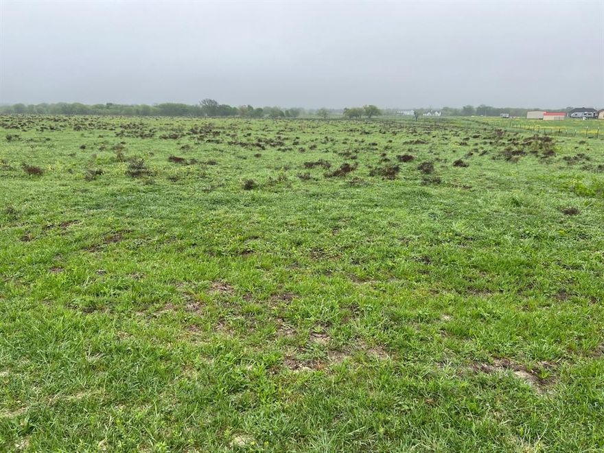 Grand View Ranch an excellent ranch community near the Dallas-Fort Worth metroplex, this 10+ acres of land is perfectly rectangle shape  ideal for those who want to enjoy peaceful ranch living without being far from the city. Just 30 minutes from Fort Worth’s vibrant downtown and only a mile from I-35, it offers quick and easy access to Dallas, Waco, and other surrounding areas. The community has about  90+ mini ranches of each 10+ acres  with minimal restrictions, very nice houses around and perfect for both residential and recreational use. This particular lot features stunning views, gently rolling terrain and ample space to build your dream modern home or barn dominium — all while enjoying the tranquility of country life and the convenience of nearby city amenities.