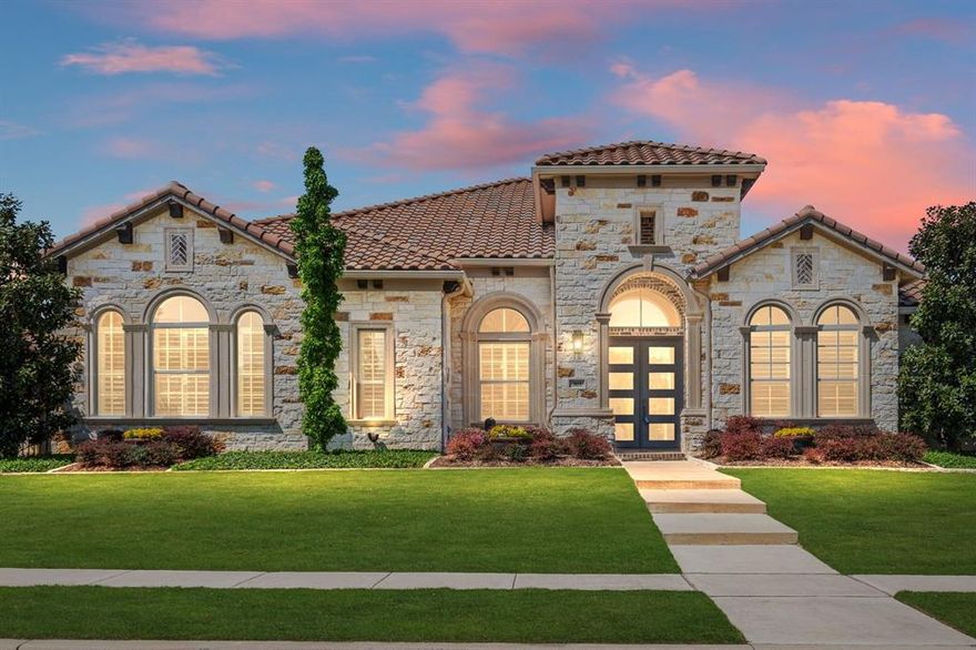 Set on a private, north-facing lot in one of Southlake’s most desirable pockets, 309 Woodsong Way offers a rare combination: a single-story custom home with architectural character, uncompromising quality, and a layout designed for modern living, all within walking distance to Southlake Town Square and zoned to coveted Carroll ISD.  Warm hardwood floors, vaulted ceilings with stained wood beams, and arched architectural details create a timeless interior, while oversized windows bring in soft natural light and serene views of the backyard retreat. The heart of the home is a chef’s kitchen anchored by a large granite island, outfitted with Wolf and Subzero appliances and elegant custom cabinetry with glass display fronts. Open to the living and breakfast areas, it’s a space equally suited for quiet mornings or gatherings that spill outside.  And that transition outdoors? Custom bi-fold doors elegantly open the living area to a covered patio complete with a gas fireplace, built-in grill, beverage fridge, and Phantom screens for year-round enjoyment. Beyond, a Claffey-designed pool and spa with UV and ozone filtration glistens beneath a canopy of mature landscaping creating a private and peaceful experience. Inside, the primary suite is a retreat: spacious, light-filled, with a spa-style bath that includes a frameless glass shower, soaking tub, dual vanities, and a customized walk-in closet. Each of the three secondary bedrooms offers an en-suite bath, and one includes direct access to the patio. The home also features a elegant powder bath, dedicated game room, fully wired media room and a beautifully appointed office with beamed ceilings. Behind the scenes, every essential has been considered: whole-home generator, tornado shelter, air scrubbers, and a five-car garage setup with hydraulic lifts and epoxy floors. This is more than a home with premium finishes. It’s a rare offering where comfort, privacy, and design converge — in a location that speaks for itself.