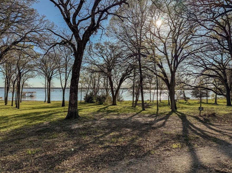 Looking for the perfect lake community to build in? You have found it! LOT 15 is 0.414 acres and would be the ideal spot to start! LOT 16 is also available. See MLS 20876278. Enjoy the tranquility of life outside the city limits while taking in captivating views of Lake Tawakoni. The secure gated community offers fantastic amenities, including a refreshing pool, tennis court, fishing pier and boat ramp. Don’t miss out on this perfect spot to create your ideal living space. Septic required. Sabine River Authority must approve septic design. Call listing agent for list of septic engineers. Cash Water states water is available for lots 15 and 16. FEC is electric provider. HOA docs on transaction desk. No Mobile Homes. Each lot is marked with white flags. MC Design also has a sign on each lot. Choose your own builder. Lone Oak ISD. Photos marking the land are approximate. Stakes are approximate. Buyer and buyer's agent to verify all information. 3 additional lots available on Bluffview Lane.