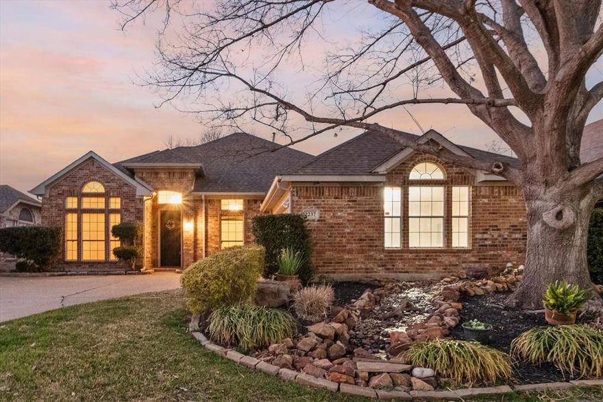 Beautifully updated, single-story home that blends comfort, style and everyday functionality in all the right ways. Property offers flexible layout that truly works for today’s lifestyle. Mature trees, manicured landscaping and custom water features set peaceful tone that continues throughout.
Inside, find extensive updates and timeless finishes. Kitchen has been tastefully refreshed with custom cabinetry, granite counters, large island, breakfast bar, updated appliances - all designed to make both everyday meals and entertaining effortless. Granite continues in baths, where updates create a cohesive, elevated feel. Spacious primary suite offers relaxing retreat; w fully updated bath featuring dual sinks, garden tub, separate shower and walk-in closet. Entire home w tile flooring; adding durability, easy maintenance and clean, polished look. Open living area w fireplace flows seamlessly to kitchen, breakfast space creating a warm. inviting setting for gathering w family, friends. Outside you’ll discover one of home’s standout features - covered patio w a fully equipped outdoor kitchen w Bull grill and refrigerator; perfect for year-round Texas entertaining. Three custom water features add charm and tranquil ambiance. Backyard also backs directly to HOA green space, includes private gate add space to enjoy.
Major system updates provide peace of mind including TRANE HVAC system installed 2019, new roof 2016 w 30-year shingles, new water heater 2019. HOA residents enjoy gated community amenities - pool, clubhouse, outdoor kitchen, bball court, playground and many green spaces. 
Located minutes from TCC SE campus; less than 20 mins to DFW Airport; and mins to shopping, dining and entertainment including Joe Pool Lake; this home offers the perfect balance of privacy and accessibility. 2237 Merritt Way is more than just a home - it’s a thoughtfully updated, move-in ready retreat in a welcoming community ready for its next chapter.