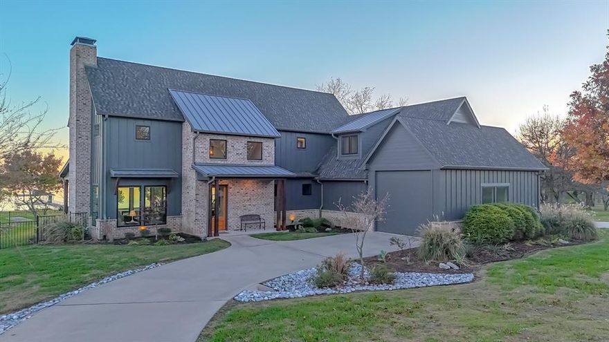 Welcome to an unparalleled lifestyle opportunity on the shores of Richland Chambers Lake, Texas's third-largest inland reservoir and premier sailing basin. Situated on a rare 3.4-acre estate with a phenomenal 480 feet of pristine waterfrontage, protected by a steel retaining wall with a concrete sidewalk. The property is strategically designed to capture ample water views from nearly every room, combining rustic charm with contemporary elegance. This meticulous 2017 custom-built home showcases a chic modern farmhouse design, offering 3,800 sq. ft. of living space, 4 Bedrooms, and 5 baths.  The Primary Suite is conveniently located on the main level, while a second, equally spacious Primary Suite is located upstairs, plus a second living-game room, an additional guest room, and a huge bunk room for the kids.  Open concept kitchen with gas stove, two ovens and dishwashers, ample cabinet space, and two large pantry areas. The 3-car garage features ample storage, 18-foot ceilings, a pass-through carport, and a circular drive for ease of boat or RV parking.  This marine dream features a Boat Dock with two boat slips with custom boat lifts, cradles, and two jet ski lifts. The expansive covered patio creates a true outdoor living area for year-round entertaining and sunset viewing. The backyard is an adventure park unto itself, featuring a custom pirate ship playhouse and an exhilarating zipline that runs toward the lake. This property is the ultimate retreat for multi-generational living, entertaining, and outdoor recreation—all enhanced by the benefit of a highly desirable Navarro County low tax rate.