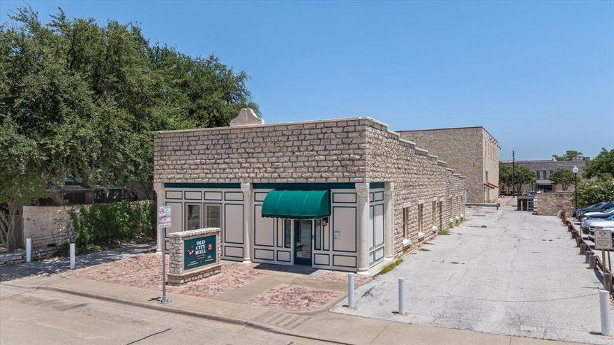 What an incredible opportunity to own a turnkey Air BNB on the historic Granbury Square.  If you are looking for retail, office or restaurant space on the square, this building would work perfectly for that as well and has already been fully remodeled using high end finishes and a designer touch.  Currently the business has 2 units.  Each can be rented separately or they can be rented together.  The front unit has 3 bedrooms, a living room, dining room and kitchen.  The back unit has 3 bedrooms-family room and kitchen. This building previously housed a law firm and was the first City Hall of Granbury.  It could easily convert from the current configuration to a law firm, title office or high end restaurant or bar.  The upscale remodel throughout makes the entire space feel new and fresh while at the same time feeling nostalgic. New luxury flooring, new roof, new electrical, new plumbing, new paint and new windows are just a few of the recent additions! Exterior security cameras ensure a secure environment.  Having your own private parking lot is a luxury not many have in the historic district of Granbury.  Rent the spaces during festivals for extra income and always have a great parking spot for customers or guests.