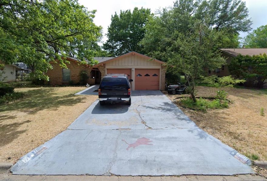 Great three bedroom house on a quiet street, close to BHS with a two car garage and a covered back porch.