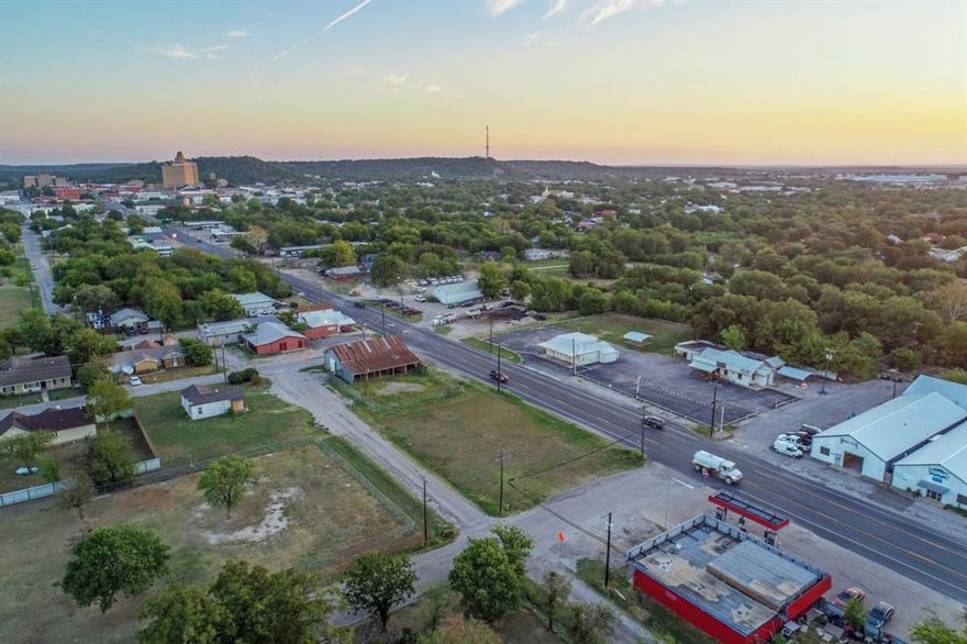 Prime corner lot with approximately 135 feet of frontage along high-traffic US Hwy 281—just 12 blocks from the revitalized heart of Downtown Mineral Wells! This clean property offers stunning views of the iconic Baker Hotel and Spa, making it an ideal location for a variety of ventures. US Hwy 281 is a major north-south corridor stretching from Mexico to Canada, offering excellent visibility and access for both local and through traffic. Zoned General Retail by the City of Mineral Wells, the lot is brimming with potential for your next business, investment, or development project. Let your vision take shape in this high-visibility location with strong growth and tourism appeal. All information in this listing is deemed reliable but should be independently verified by the buyer.