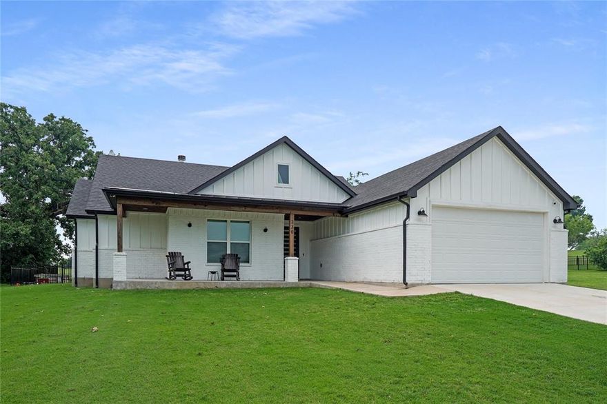 Discover refined country living in this stunning modern farmhouse, ideally situated within the scenic Runaway Bay resort community. Perfectly positioned along the 16th hole of the RB Golf Club, this home offers peaceful golf course views and is just a short stroll from the shores of beautiful Lake Bridgeport.
Step inside to an inviting, light-filled interior highlighted by soaring 10-foot vaulted ceilings and an open-concept design that seamlessly blends comfort and sophistication. Thoughtfully designed with a split-bedroom layout, this home provides both privacy and functionality. The spacious primary suite serves as a true retreat, featuring a spa-inspired bathroom complete with a freestanding soaking tub and an oversized glass walk-in shower.
Designer details shine throughout, including shiplap and board-and-batten accent walls, along with a chef-inspired kitchen offering abundant storage and stylish finishes—perfect for both everyday living and entertaining.
Enjoy the outdoors year-round with expansive covered front and back patios, ideal for relaxing and taking in the tranquil surroundings. The generous yard space adds to the home’s appeal, while additional features such as full encapsulated spray foam insulation, gutters, and dedicated space for a golf cart provide comfort, efficiency, and convenience.
This exceptional property combines modern elegance with laid-back lakeside living—an opportunity you won’t want to miss.