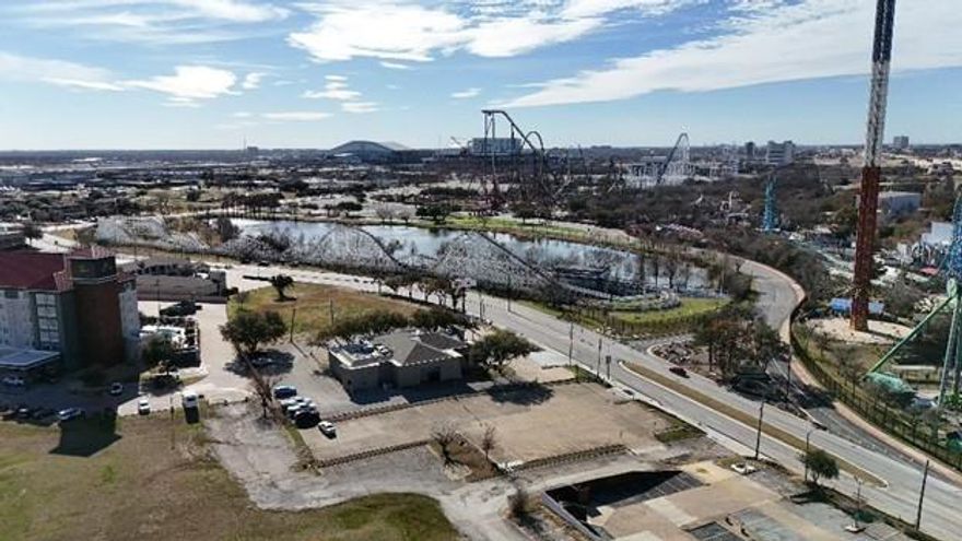 Rare income producing vacant commercial lot for sale directly across from Six Flags Theme Park & in close proximity to AT&T Stadium & Globe Life Field. There is currently a contract in place with a premier parking company. The site yields roughly $160k in gross profis which the current owner is due 50% throughout the year. A new owner can immediatley earn income prior to re-developing the parcel or elect to not re-new the agreement post expiration and create a self managed parking business. 

Property is located within the City of   Arlington's Entertainment District Overlay (EDO) which is intended to create an identifiable & exciting character for the 2,700-acre entertainment area in the central city. New development & redevelopment in the EDO district is guided by development standards intended to promote a complementary mix of land uses & physical design per City of Arlington's Planning & Zoning division. 

This site, formerly a Steak & Ale restaurant, is equidistant between Dallas & Fort Worth, is easily accessible from I-30 and Hwy 360 & is best suited for high density development such as hotels, restaurant & retail. Traffic counts on Six Flags Dr are 6,983 vehicles per day & 178,000 on Hwy 360 per CoStar analytics. 2022 average household income within a 5 mile radius is $66,386 with a population totaling 312,054. Survey in transaction desk.