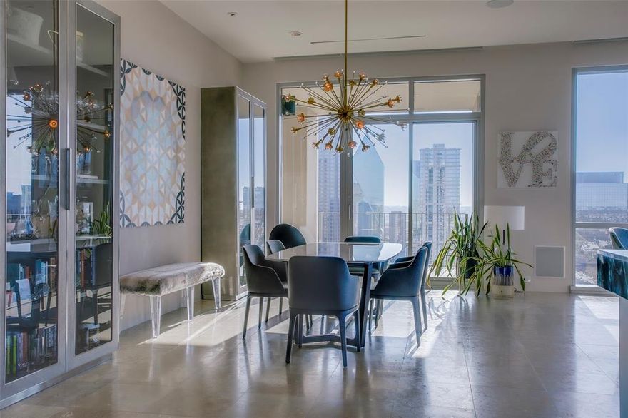 Luxury one of a kind Three bedroom floor plan with panoramic views in this Lionel Morrison iconic One Arts High rise..  Sub Penthouse No apt above you or on any of all three sides of this home. Totally reimagined and remodeled apt with large entry foyer for art. Open plan oversized Living and Dining room with incredible views of Downtown Arts District and west all the way to Love Field, Uptown and Klyde Warren Park. Remodeled open plan Bulthaup kitchen anchors this incredible space. Custom metal and glass door gives privacy to the Third bedroom or study. Master suite is totally self contained with custom walnut closet that looks like it's out of a high-end boutique. Updated Master bath with steam and body jet shower, and private commode area with self washing toilet. Second bedroom with custom lacquered closets and ensuite. Guest Powder room and Laundry room with built in Miele coffee machine. Venetian plaster walls and custom paints, sound system, Lutron lighting system, new electric blinds and custom sheers.The Next Move is yours.