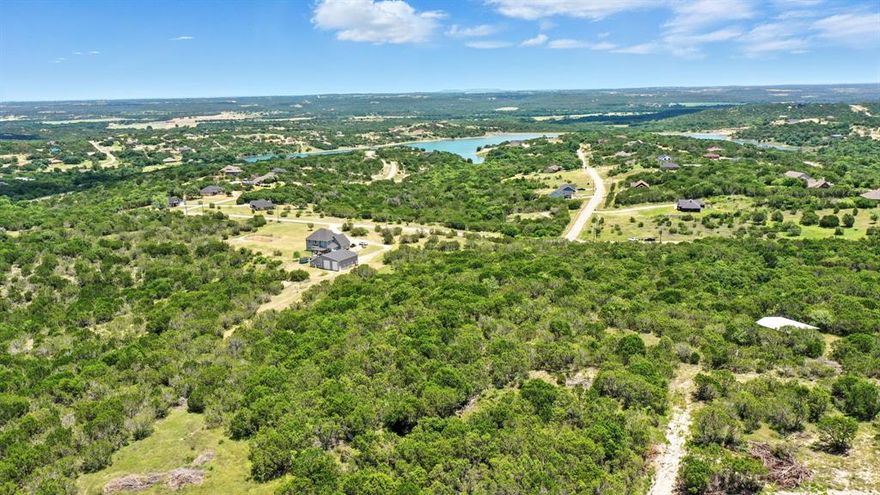 Find your own slice of paradise with this fabulous 5 acre tree covered property in Bluff Dale, Tx.  Ideal for building your dream home and creating a peaceful retreat, or investing in land for future use.  You will find this lot has an easy of access from the front of the development many level areas to build upon and convenient to the boat ramp of the recreational lake and also the community swimming pool.   Enjoy exceptional community amenities including First-class fishing, Recreational boating, RV Park, Community pool and Clubhouse, Play park, Exercise park, Garden co-op, and more! Convenient drive to DFW, Granbury, Glen Rose, Weatherford and Stephenville. Come enjoy this rare opportunity to own land that offers both tranquility and a vibrant amenity rich lifestyle.  Bluff Dale TX, the place to call home.
See you in Bluff Dale!