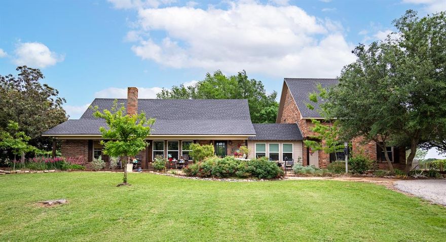 Tucked away on three serene acres in Celina, this beautifully updated farmhouse invites you to slow down & savor the quiet beauty of country living. Framed by mature trees & peaceful views, the property unfolds like a private retreat, complete with a blackberry patch, a charming barn, & a spacious 2024 covered pavilion perfect for gatherings under open skies surrounded by lush gardens. At the heart of the property, the main house blends warmth & modern updates with ease. The kitchen shines with 2026 quartz countertops, hardwood flooring & updated light fixtures, while major systems offer peace of mind, including a 2023 HVAC, 2021 water heater, & 2020 roof. The primary suite provides a peaceful escape with a soaking tub added in 2023. A sun-filled enclosed sunroom (2016) offers year-round enjoyment with a wood burning fireplace & kitchenette with a range, & upstairs a game room with two built-in beds & a full bath creates a fun, flexible space for guests or family. Step outside to an inviting courtyard centered around a tranquil fountain & a freestanding hot tub, an ideal setting for relaxing evenings. 2 secondary bedrooms (one with a built-in Murphy bed) a full bathroom, a home office, & an exercise room complete the main house. Above the 2 car garage houses a garage apartment (loft) with a full bathroom & kitchenette. Beyond the main home, the property continues to impress with a 1,185 sq ft guest cottage completed 2021 with 2 bedrooms, 2 baths, living, kitchen & covered patio. Both the garage apartment & cottage are currently successful income-producing short-term rentals, yet equally suited for multi-generational living, in-laws, or independent space for older children. The garage apartment features its own 2024 HVAC & 2022 water heater. Whether you envision a private homestead, an income-generating opportunity, or a blend of both, this one-of-a-kind property offers endless possibilities wrapped in peace, privacy, and timeless charm.