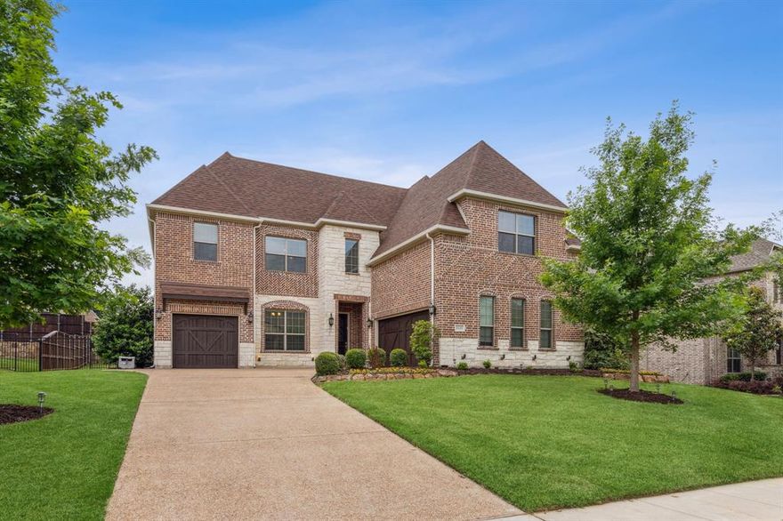 Space, layout, and location all coming together in one—a 5-bedroom home in highly rated Prosper ISD, just a short walk to Prosper High School and Frontier Park. Inside, vaulted ceilings and expansive windows bring in natural light and give the home an open, airy feel that carries throughout. The kitchen is anchored by real wood cabinetry, granite countertops, and a gas cooktop, all flowing naturally into the main living space where everything connects. Two bedrooms on the first floor include a private ensuite that’s ideal for visitors or an in-law setup, plus a dedicated mud room that makes everyday life run a little smoother. Upstairs, a large game room and media room offer the extra space everyone wants without sacrificing the flow of the home. Crown molding and a grand foyer add just the right amount of presence, while the 3-car garage with epoxy floors and a generously sized yard give you room to live the way you want to. Out back, a covered patio, stamped concrete, and hot tub create a setting that’s easy to enjoy year-round. Recent updates include roof, fresh fence stain, painted garage doors, and an upstairs AC unit.