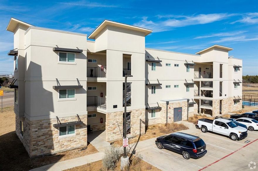 Ensign Apartments offers modern, comfortable homes with thoughtful interior finishes and a range of convenient amenities. Units feature stylish kitchens with granite countertops, stainless steel appliances, and dishwashers. Other interior details include walk-in closets, ceiling fans, wood-style or vinyl flooring, in-unit washer and dryer hookups, and plenty of natural light. 
The community is pet-friendly and provides outdoor and shared spaces like a swimming pool, playground, and landscaped common areas. There’s surface parking available, and the location is close to local dining, parks, and schools, making it a balanced choice for those seeking convenience and modern amenities.