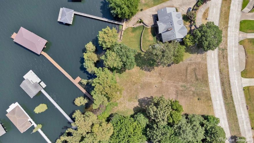 Did the end of Summer have you wishing you owned waterfront property? Well then check out this last Lake Front Lot of it's kind! Fantastic location on South Lakeshore Drive Located just minutes from I-220 and I-20. Loads of potential and a home that would provide endless sunset views. Enjoy lake days and have direct access as a homeowner with this fabulous boat house and pier! Boat house has 3 slips for boat storage and a side deck with another landing with a ladder at the furthest point of the pier.