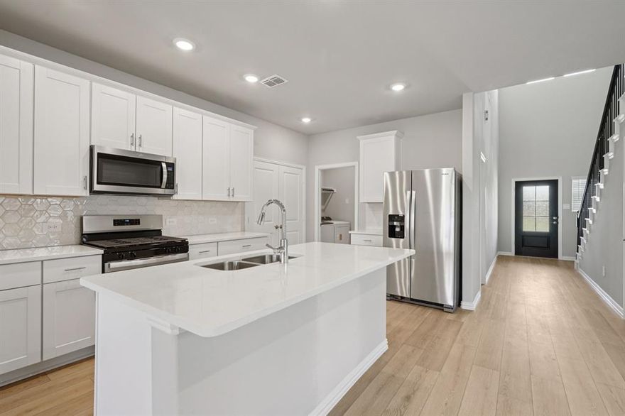 BRAND NEW energy - efficient home Jan 2026! Turn the kids loose in the second-story loft space while hosting downstairs in the open concept living area. White cabinets with veined white quartz countertops, tan tone EVP flooring and light grey brown textured carpet.  Lakehaven is a master-planned community located at the edge of Lavon Lake, featuring all of the modern amenities. Family time will turn into lake time during the warm Texas summers. The Spring Series will boast six floorplans from our National Park Collection that range in size from approximately 1,270 sq. ft. to 2,255 sq. ft. Each of our homes is built with innovative, energy-efficient features designed to help you enjoy more savings, better health, real comfort and peace of mind.