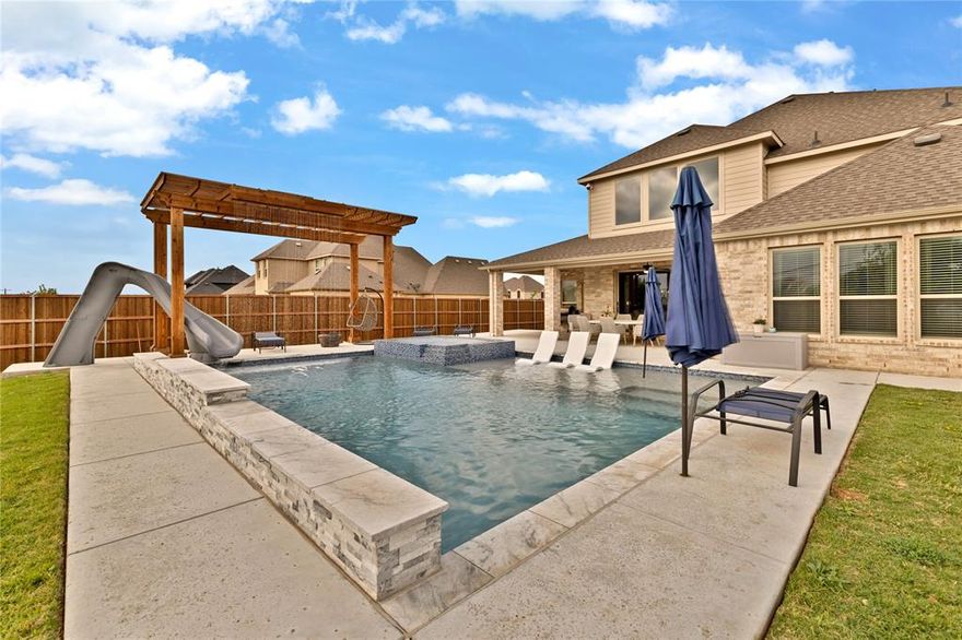 Heated pool with outdoor living area, expansive 4,515 sq ft layout, and a half-acre lot set this 5-bedroom, 4 full bath Ovilla home apart. With 3 living areas, a dedicated office, media room, and 3-car garage, this property offers the space and flexibility today’s buyers are looking for.
Inside, wood-look ceramic tile plank flooring runs through the main living areas, combining durability with a clean, modern feel. The open-concept kitchen and living space are designed for both everyday living and entertaining, featuring granite countertops, a double oven, ample cabinetry, and generous workspace.
The primary suite offers a private retreat with a spacious bedroom, en suite bath, and walk-in closet. Additional bedrooms are well-sized and supported by multiple living areas, allowing flexibility for guests, multi-generational living, or work-from-home needs.
Step outside to the backyard designed for year-round enjoyment. The heated pool and large covered patio create an ideal setting for entertaining or relaxing, all situated on a 0.50-acre lot with room to enjoy both privacy and space.
Located in Ovilla, this home provides a balance of quiet residential living with convenient access to nearby shopping, dining, and commuting routes.