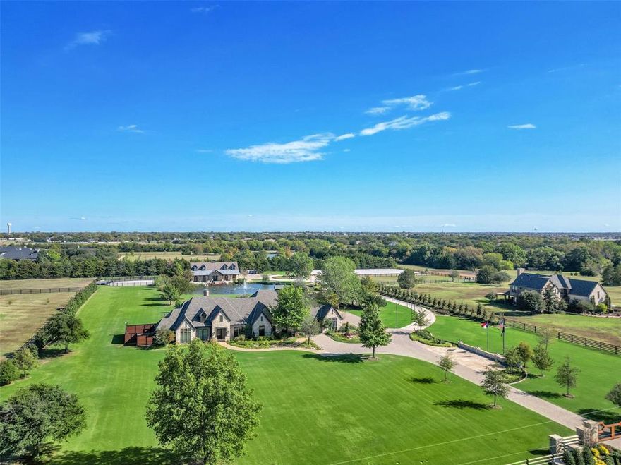 Minutes from downtown Dallas! Rick Shipley Custom Home. This stunning estate sits on 13.432 acres. Beautifully renovated w every detail imaginable. Stunning views of the grounds from entry & great room. Unlike anything on the market! Chef’s kitchen with Quartzite counters, Wolf & Subzero appliances. Well-appointed primary suite w views, fireplace, true spa bath & custom closet. Lg flex room, laundry & guest suites complete the main level. Second level offers a lg game room w views, wet bar, full bath, & separate media room that’s perfect for entertaining or guest area.  Stroll the spectacular grounds & enjoy the covered patio w outdoor grill, pool & spa w sundeck, large private pond, dressage arena, & 6 paddocks.  The action-packed barn is for the equestrian at heart! 5 stalls, wash station, office flex space, tack room & half bath.  Additional 1,100 sf guest quarters w kitchen, living, bedroom & full bath. Grounds irrigated from a well. Short distance to Lake Ray Hubbard.