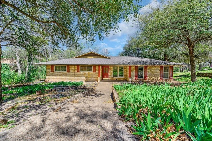 This four-bedroom, two-bath home in the highly sought-after Midway ISD and zoned to Woodway Elementary is ready for your personal touch. This home has vinyl plank flooring throughout the living areas and bedrooms. The spacious living and dining combo has built-ins, a  non-wood-burning fireplace and access to the side patio. The kitchen is equipped with a built-in double oven, cooktop, vent-a-hood, and breakfast area. A second living area offers versatility with two built-in desks, bookshelves, a large storage closet, and access to the back patio—perfect for a home office, study, or playroom. The isolated primary bedroom has two closets and built-ins. The primary bath has a walk-in shower, dual vanities and a separate dressing vanity. Three additional bedrooms also feature vinyl plank flooring. With ample storage, functional built-ins, and a great layout, this home is a fantastic opportunity in a desirable neighborhood! $319,900