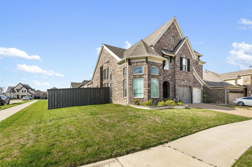 Experience refined living in Prairie Ridge, a sought-after community offering exceptional amenities including a resort-style pool, splash pad, playgrounds, and over 15 miles of scenic hiking and biking trails.
This stunning Tudor-style residence built by Grand Homes showcases timeless architecture with a striking stone exterior and elegant designer finishes throughout. From the moment you enter, you’re welcomed by a dramatic curved staircase with wrought iron spindles, rich hardwood flooring, and custom trim detailing that elevate the home’s sophisticated charm.
Designed for both everyday living and entertaining, the home features a private office, formal dining room, and a breathtaking vaulted family room filled with natural light. A convenient first-floor guest suite offers flexibility for visitors or multi-generational living.
At the heart of the home is the chef-inspired kitchen, beautifully appointed with quartz countertops, light gray shaker cabinetry, stainless steel appliances, a gas cooktop, and an oversized island perfect for gathering and entertaining.
Upstairs, you’ll find a spacious game room and dedicated media room, providing the ultimate space for relaxation, entertainment, and family fun.
The luxurious primary suite offers a private retreat with a spa-inspired bath featuring a freestanding garden tub, creating the perfect space to unwind.
Blending elegant design with modern comfort, this exceptional home offers a lifestyle of comfort, convenience, and community living.