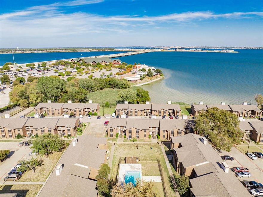 Welcome to a charming and serene condo retreat about 20 minutes from the heart of Dallas. This cozy one-bedroom unit has been thoughtfully refreshed with new paint throughout (2024) and features an entirely new HVAC system and roof (2023), ensuring comfort all year round. Step into the inviting living area, where natural light pours in, creating a warm and welcoming space perfect for relaxation. Adjacent, the efficient kitchen is equipped for all your culinary needs, with a fridge and microwave that conveys to add convenience for your move-in. The primary bedroom offers a peaceful escape for restful nights. The curtains also convey, and the washer and dryer are negotiable, providing flexibility to suit your needs. This upper-level unit is graced with a covered balcony for the perfect spot to unwind and enjoy quiet surroundings, and don’t forget to unwind in the pool after a long day. Private access to the lake and canoe storage less than 2 minute walk from condo. Situated close to the scenic Lake Ray Hubbard, you’re within moments of beautiful lake views, fishing spots, and trails for an outdoor adventure. Garland is known for its vibrant parks and community events, offering a balanced lifestyle in a peaceful setting. Discover the charm and ease of condo living in a location that blends tranquility with accessibility for delightful escape near the lake and close to Dallas.