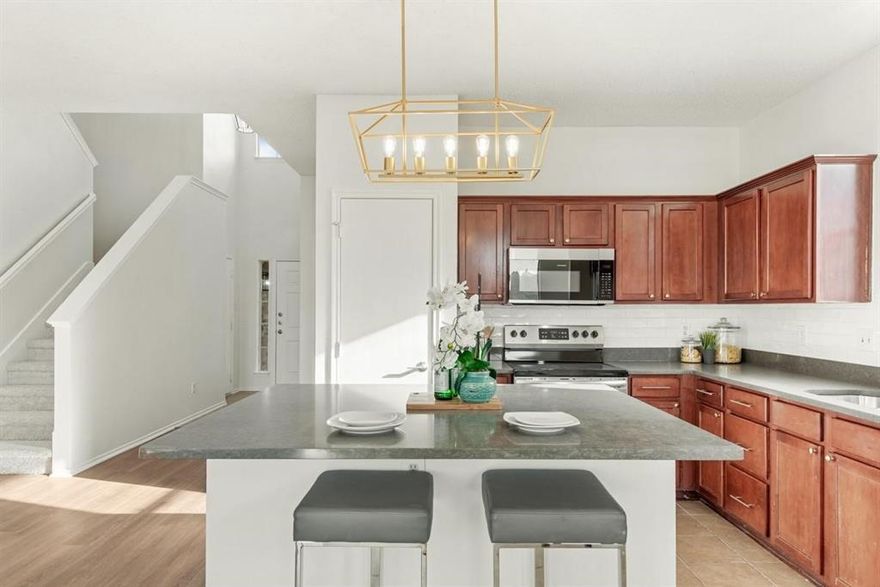 Welcome to this beautifully maintained and updated two-story brick home! Step inside to an open floor plan, featuring an inviting eat-in kitchen with stainless steel appliances, a spacious pantry, and a large kitchen island. The primary suite is conveniently located on the first floor, complete with a walk-in closet and ensuite bathroom featuring quartz countertops, dual sinks, and a separate shower. An additional bedroom downstairs provides flexibility for guests, a home office, or multigenerational living. Upstairs, you'll find two more bedrooms and a versatile second living area — perfect as a game room or media space. Step outside to a private backyard for gatherings or relaxing evenings. Recent updates include a brand new roof with a transferable warranty, new gutters, and fresh siding, offering peace of mind for years to come. Located in the highly sought-after Wylie ISD, known for its top-rated schools, and offering easy access to major roads, shopping, dining, and beautiful Lavon Lake — this home truly has it all!