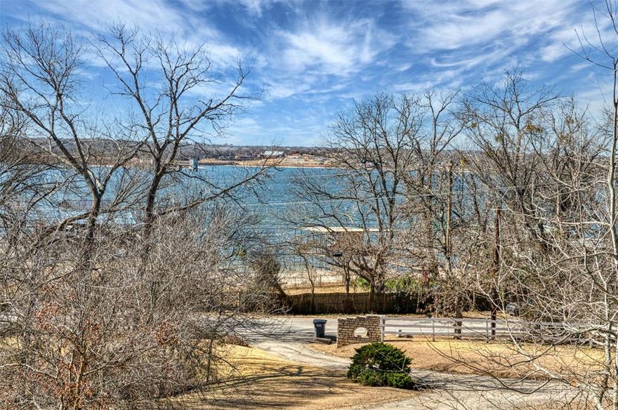 Nestled on 1.57 acres of naturally beautiful Texas landscape, this picturesque property offers peaceful, elevated views overlooking a nearby lake, all without the premium of lakefront maintenance.  Built in 1981, this spacious 4 bedroom, 3 bath home sits on gently rolling, hilly terrain that enhances both privacy and scenic charm.  With solid bones and timeless character, the home is ready for a touch of TLC, making it a wonderful opportunity to personalize and add value. Large windows invite in natural light and capture the surrounding countryside, while the expansive land provides room to roam, garden, or simply enjoy the tranquility of nature.  Enjoy the best of both worlds , quiet country living with convenient access to nearby shopping, restaurants, fast food, and quick freeway access for an easy commute.  The property is equipped with its own well and septic system, offering self sufficient country living with wide open space and native Texas beauty in every direction.  If you're seeking serenity, views, and potential, this hidden gem delivers.